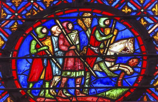 Knights Horse Medieval Life Stained Glass Saint Chapelle Paris France.  Saint King Louis 9th created Sainte Chapelle in 1248 to house Christian relics, including Christ's Crown of Thorns.  Stained Glass created in the 13th Century and shows various biblical stories along with stories from 1200s.