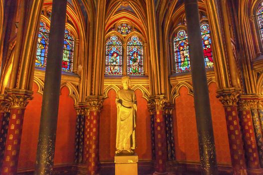 Louis 9th Memorial Stained Glass Lower Chapel Saint Chapelle Paris France.  Saint King Louis 9th created Sainte Chapelle in 1248 to house Christian relics, including Christ's Crown of Thorns.  Stained Glass created in the 13th Century and shows various biblical stories along with stories from 1200s.