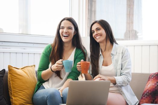 Female friends studying at the local coffee shop