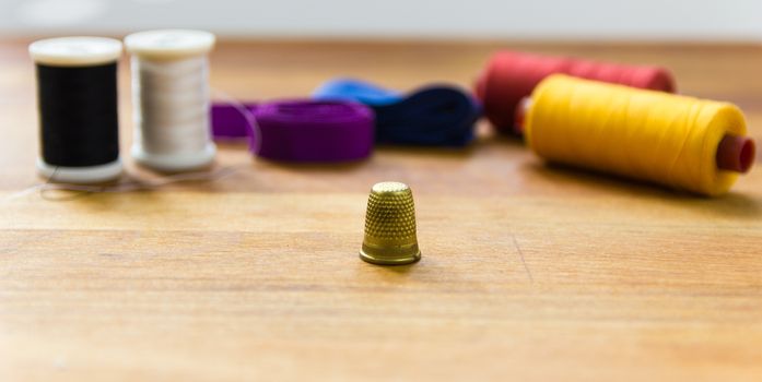 thread, needle, thimble and sewing kits are the Tailor