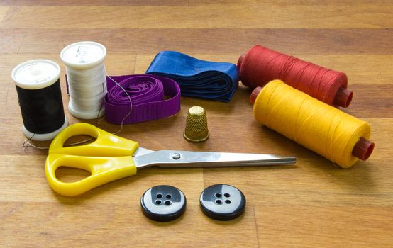 thread, needle, thimble and sewing kits are the Tailor