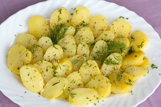 Delicious boiled potatoes with dill and olive