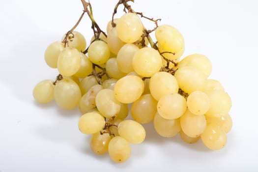 Sweet and ripe white grapes isolated on white
