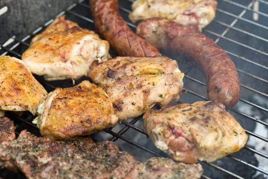 barbecue with delicious grilled meat on grill 