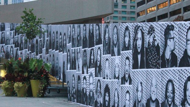 CANADA, Toronto:  Nathan Phillips Square is covered with portraits from the Inside Out exhibit on October 4, 2015 during Nuit Blache . Inside Out is a participatory art project that allowed people to have their portraits taken in the photo booth on site, and added to the exhibit.