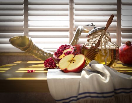 Honey jar with apples and pomegranate for Rosh Hashana religious holiday