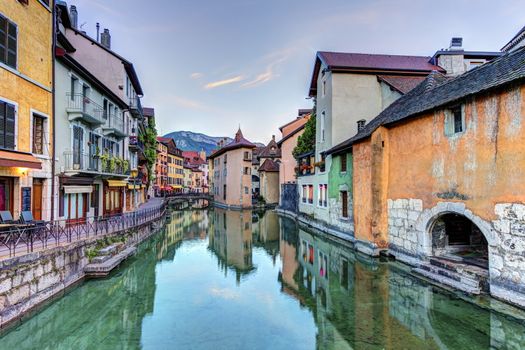 Quai de l'Ile and canal in Annecy old city with colorful houses, France, HDR