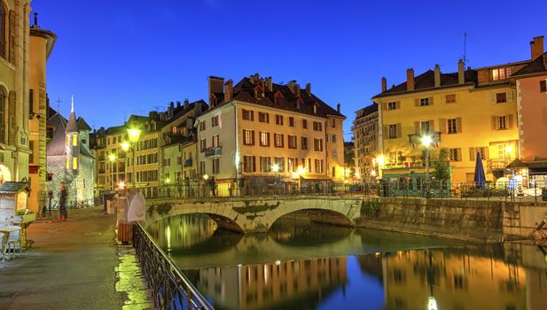 Palais de l'Ile jail, Perriere bridge and canal in Annecy old city by night, France, HDR