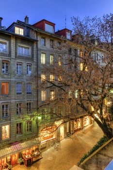 Street and restaurants in old city by night, Geneva, Switzerland