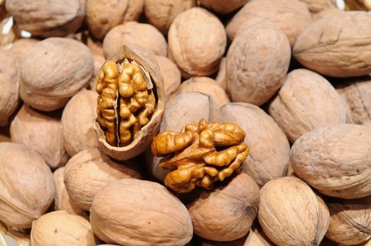 walnuts in shell in basket stock photo