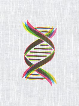 Health concept: CMYK DNA on linen fabric texture background