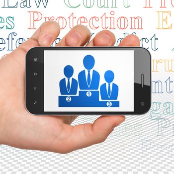 Law concept: Hand Holding Smartphone with  blue Business Team icon on display,  Tag Cloud background