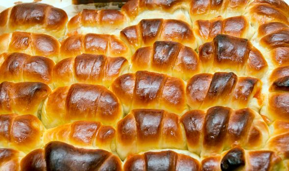 A tasty croissant with jam made from rose hip jam.