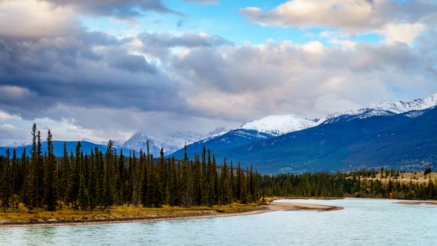 Daybreak over the Athabasca River near the town of Jasper in Jasper National Park in the Canadian Rocky Mountains