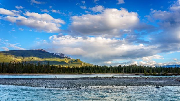 Daybreak over the Athabasca River near the town of Jasper in Jasper National Park in the Canadian Rocky Mountains