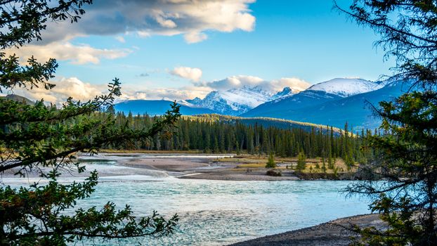 Daybreak over the Athabasca River near the town of Jasper in Jasper National Park in the Canadian Rocky Mountains