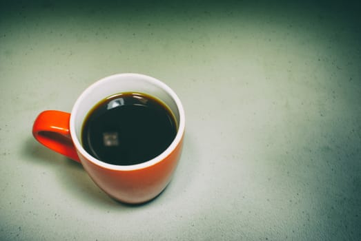 Photograph of red cup of coffee