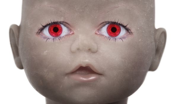 Scary doll face with human looking eyes