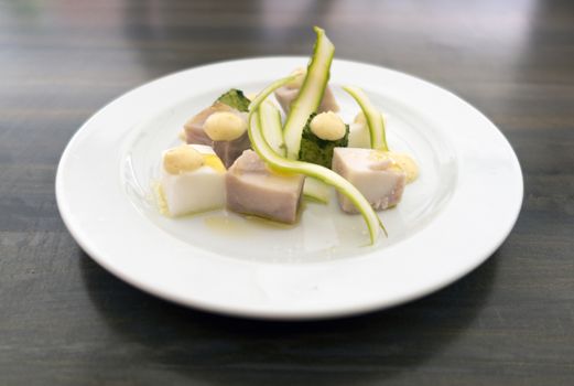 Homemade ham from farm rabbit, kohlrabi, radishes, asparagus and fennel - shallow depth of field