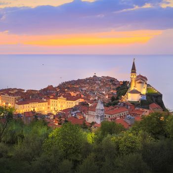Romantic colorful sunset over picturesque old town Piran, Slovenia. Senic panoramic view. Square composition.