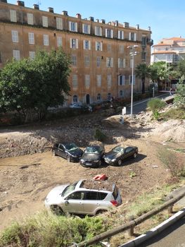 FRANCE, Cannes : Some cars piled up in a street in Cannes, southern France, on October 4th, 2015 after fatal flooding. Deluge due to violent storms in the region of Alpes-Maritimes happened in the night between October 3rd and 4th, 2015, and caused the death of at least 17 people. 