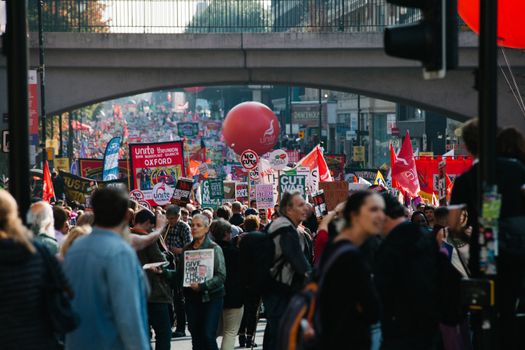 UNITED KINGDOM, Manchester: Protesters holding placards are seen during an anti-austerity march organized by The Peoples Assembly in protest against the Conservative Party Conference in Manchester, United Kingdom on October 4, 2015. The demonstrators were protesting against cuts on benefits, National Health System reforms and restriction on the ability for trade unions to go on strike.  