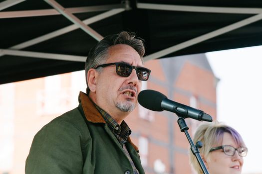 UNITED KINGDOM, Manchester: John Rees from Stop the War Coalition speaks during an anti-austerity march organized by The Peoples Assembly in protest against the Conservative Party Conference in Manchester, United Kingdom on October 4, 2015. The demonstrators were protesting against cuts on benefits, National Health System reforms and restriction on the ability for trade unions to go on strike.  