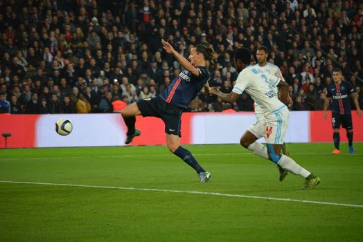 FRANCE, Paris : Zlatan Ibrahimovic hits a ball on the Parc des Princes field during a Ligue 1 match between Paris-Saint-Germain and Marseille on October 4th, 2015. The player became the PSG's top goalscorer of all time when he led the French champions to a 2-1 home win against Marseille. 