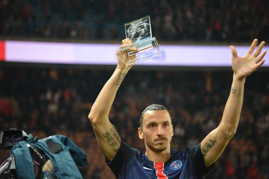 FRANCE, Paris : Zlatan Ibrahimovic held his top scorer trophy on the Parc des Princes field during a Ligue 1 match between Paris-Saint-Germain and Marseille on October 4th, 2015. The player became the PSG's top goalscorer of all time when he led the French champions to a 2-1 home win against Marseille. 