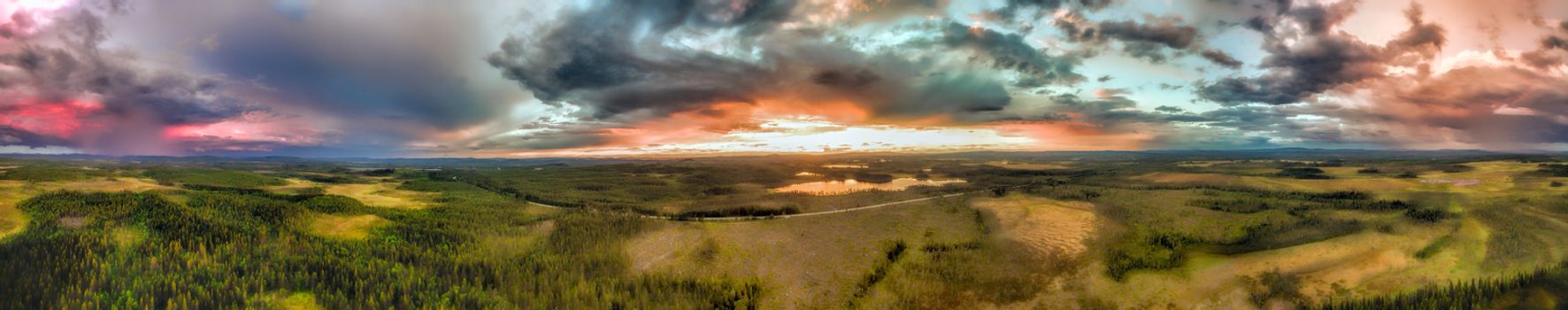 Aerial panorama of huge storm clouds over the forests in Sweden