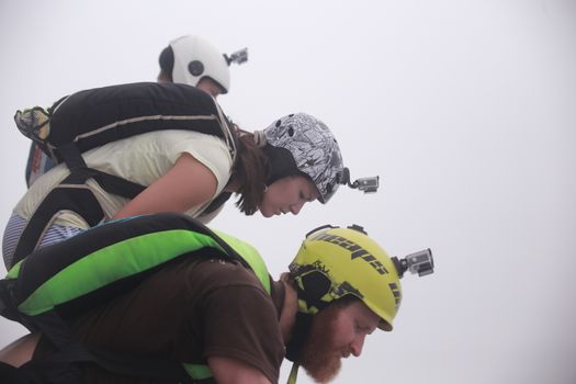 MALAYSIA, Kuala Lumpur: Base jumpers look over edge	Heavy haze didn't deter the 120 thrill-seeking base jumpers as they leapt into the foggy abyss off Kuala Lumpur Tower on October 3, 2015.  	The participants were joining others across the world on the 15th�International Base Jump Day. 