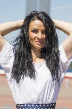 Photo of brunette woman with upward hands
