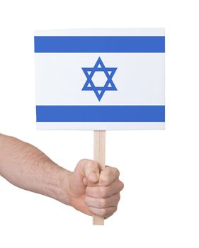 Hand holding small card, isolated on white - Flag of Israel