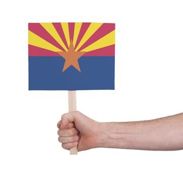 Hand holding small card, isolated on white - Flag of Arizona