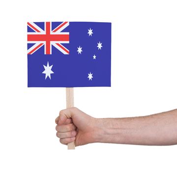 Hand holding small card, isolated on white - Flag of Australia