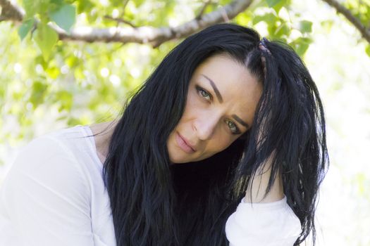 Photo of Caucasian brunette woman in white