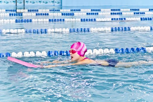 Photo of cute girl in swimming pool