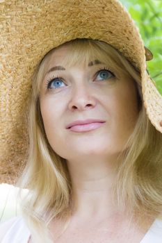 Photo of European blond woman looking upward