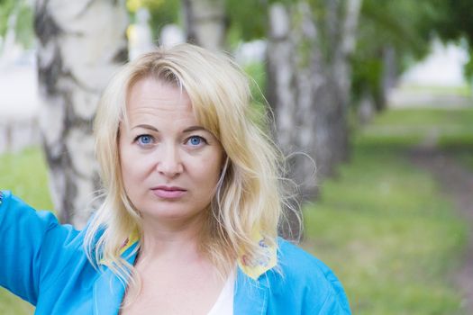 European blond woman with long hair and blue eyes