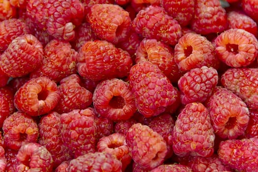 Photo of the background fresh red raspberry