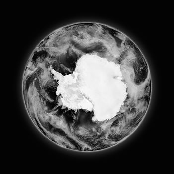 Antarctica on dark planet Earth isolated on black background. Highly detailed planet surface. Elements of this image furnished by NASA.