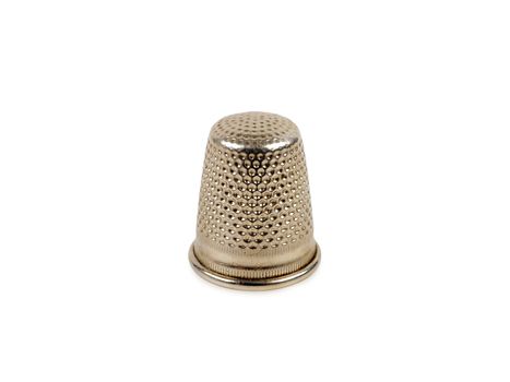 silver thimble isolated on white background       