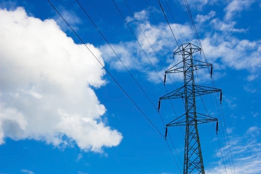 Power lines against the blue sky.