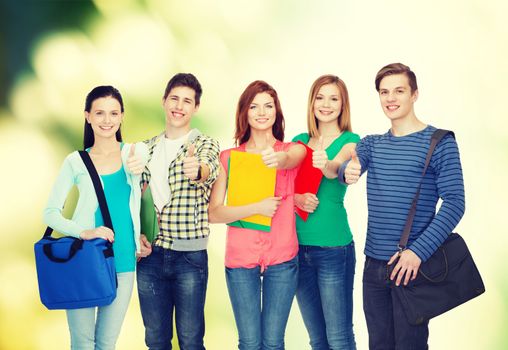 education and people concept - group of smiling students standing