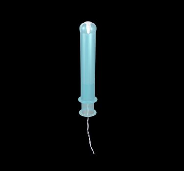 a blue plastic applicator tampon on black