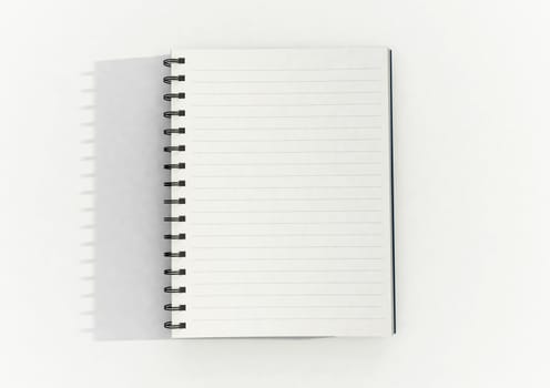 Notepad on white surface and low light