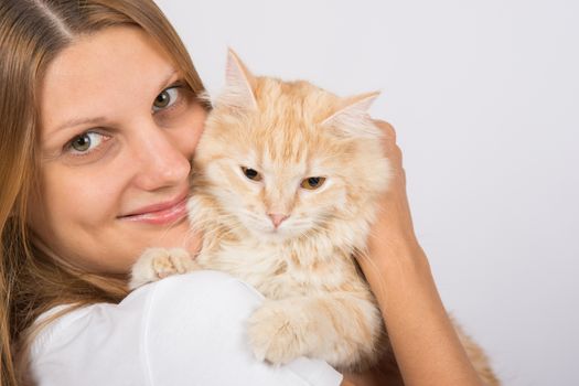 Young girl Europeans embracing his domestic cat