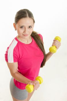 Young beautiful girl athlete Europeans conducting physical training