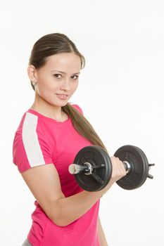 Young beautiful girl athlete Europeans conducting physical training