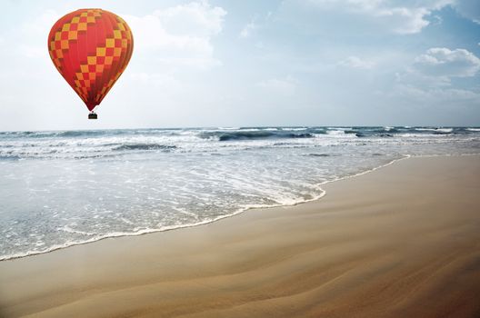 Air balloon flying over the tropical summer beach